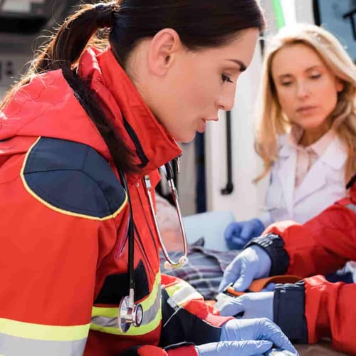 medical-professionals-assist-patient-inside-ambula-2026-03-11-04-20-29-utc (1)